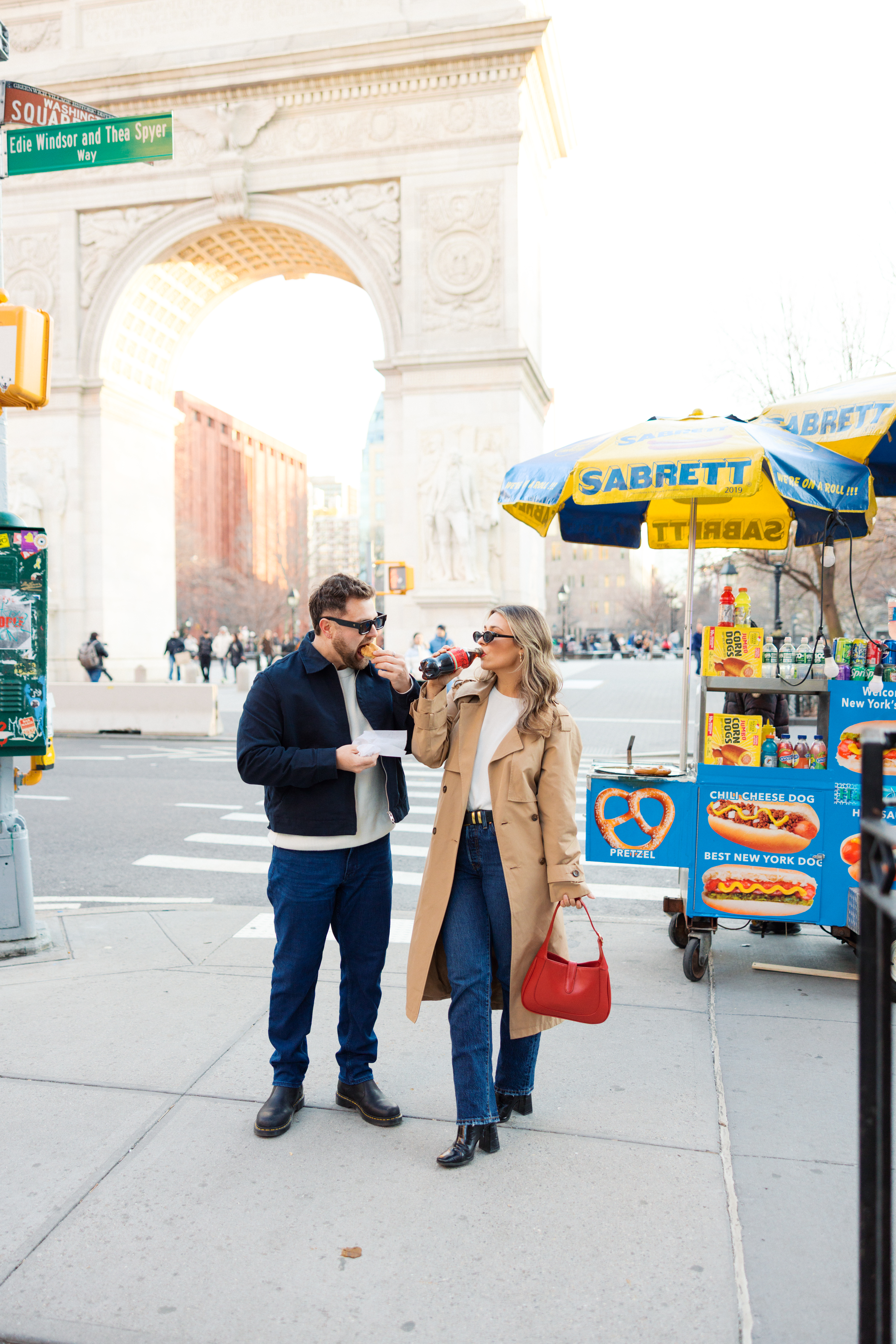 Couple walking through SoHo streets surrounded by classic architecture