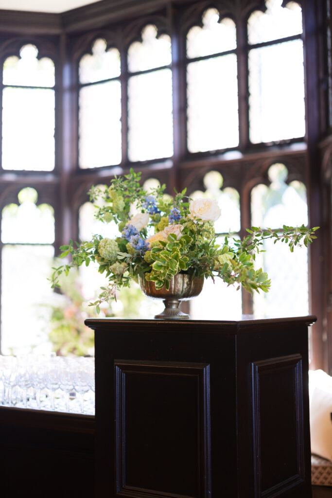 Wedding flowers displayed inside Hempstead House window alcove.