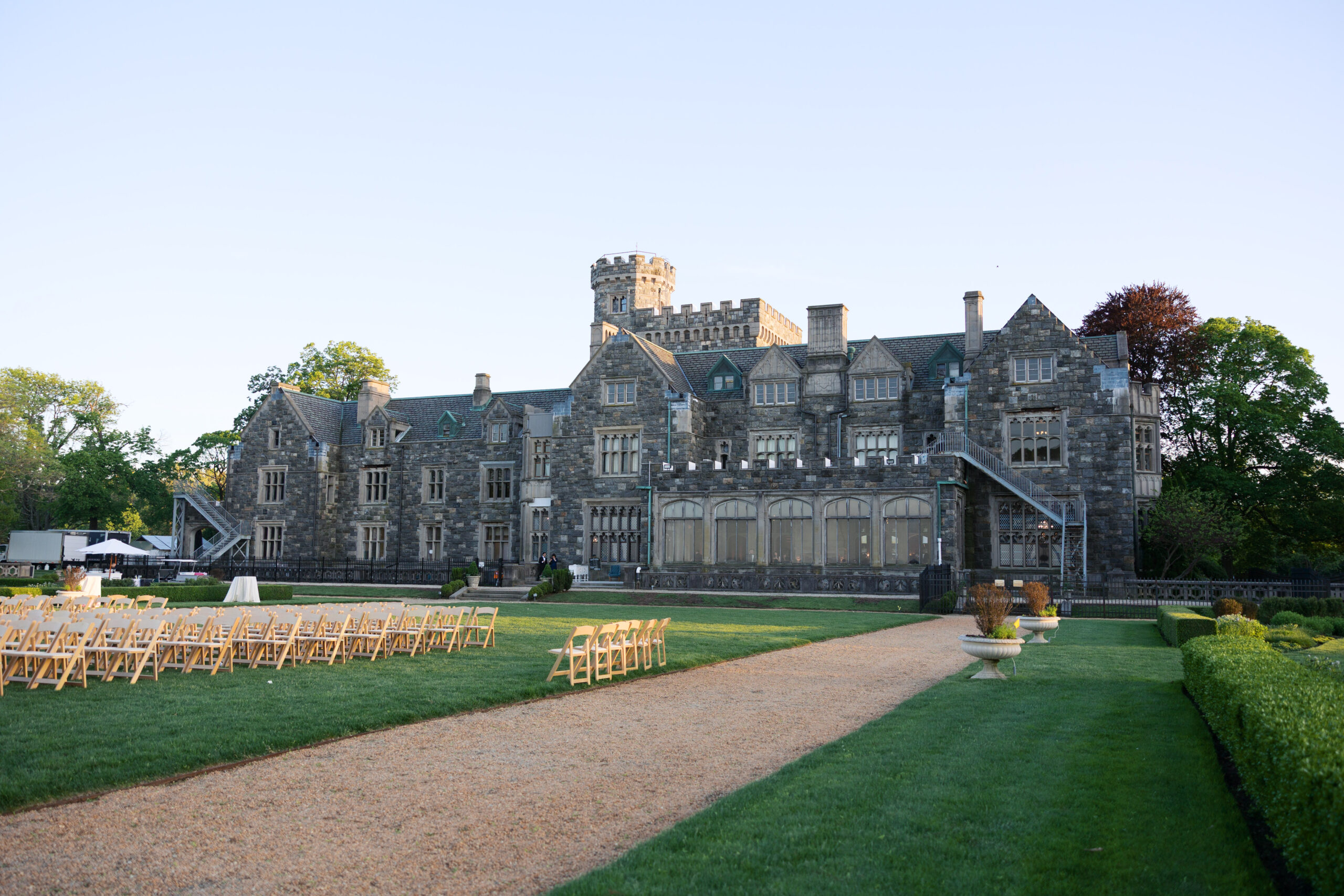 Hempstead House mansion exterior with wedding ceremony chairs set up.