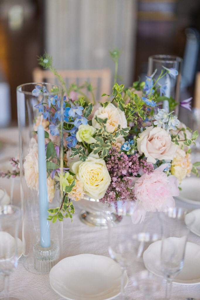 Wedding reception table flowers with roses inside Hempstead House.