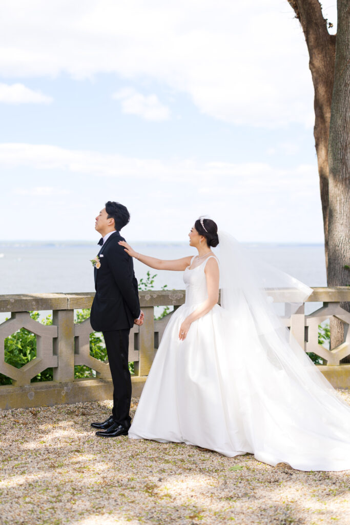 Bride and Groom first look on terrace at Hempstead House wedding venue.