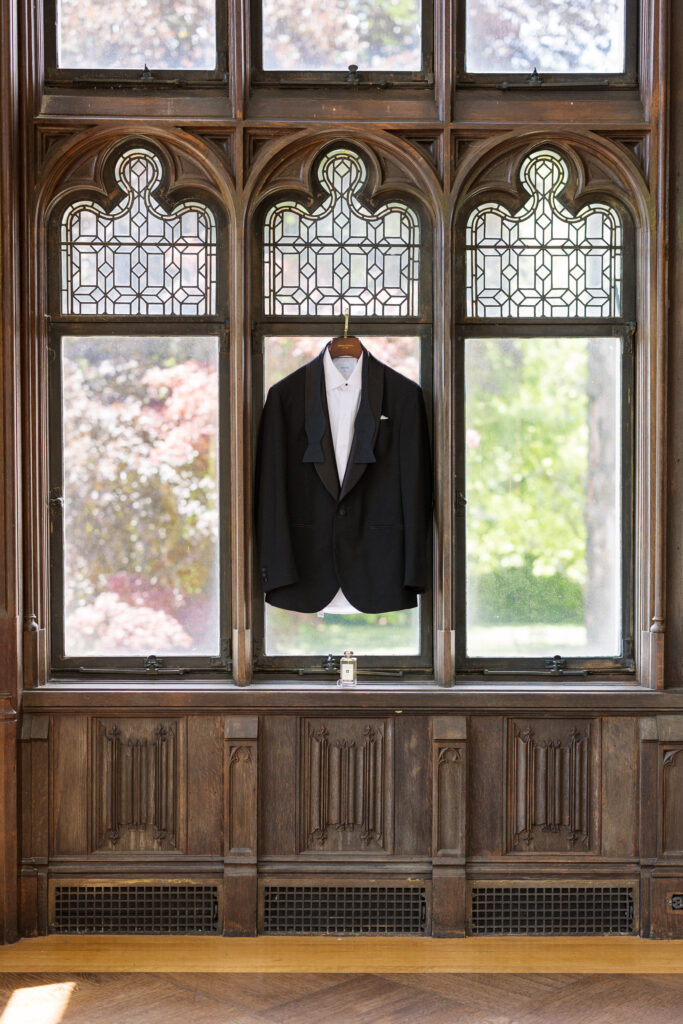 Groom’s tuxedo jacket hanging at Hempstead House Long Island venue.