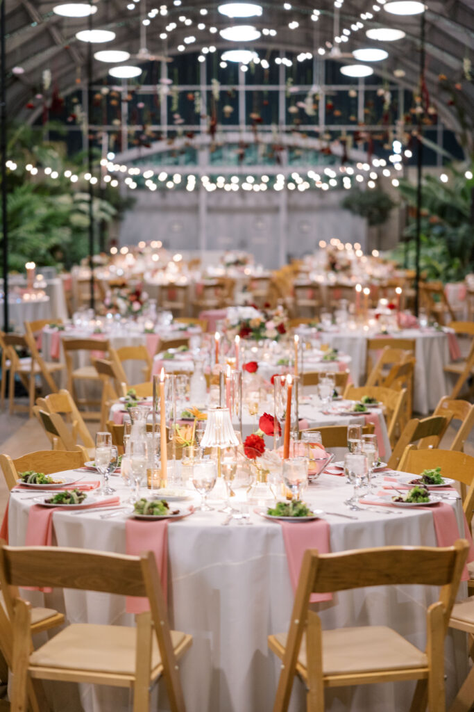 A stunning fall wedding at Garfield Park Conservatory in Chicago. The vibrant autumn foliage serves as a breathtaking backdrop for a couple’s ceremony in the Horticulture Hall, with floor-to-ceiling windows letting in the perfect natural light. Captured by Violet Carter Photography.