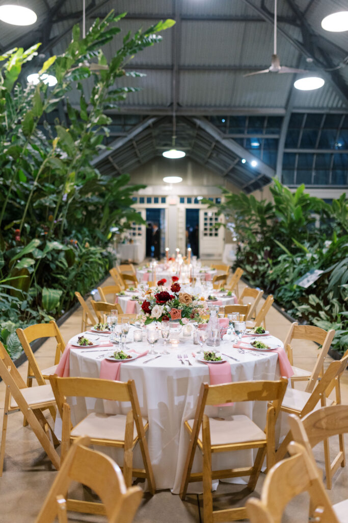 A stunning fall wedding at Garfield Park Conservatory in Chicago. The vibrant autumn foliage serves as a breathtaking backdrop for a couple’s ceremony in the Horticulture Hall, with floor-to-ceiling windows letting in the perfect natural light. Captured by Violet Carter Photography.