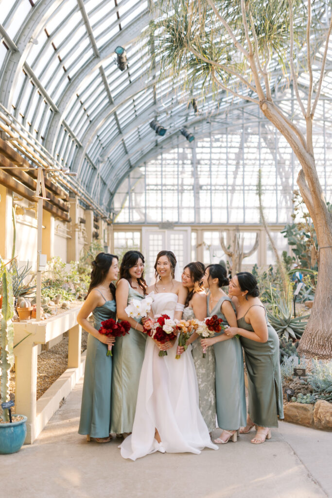 A stunning fall wedding at Garfield Park Conservatory in Chicago. The vibrant autumn foliage serves as a breathtaking backdrop for a couple’s ceremony in the Horticulture Hall, with floor-to-ceiling windows letting in the perfect natural light. Captured by Violet Carter Photography.