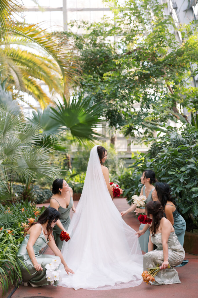 A stunning fall wedding at Garfield Park Conservatory in Chicago. The vibrant autumn foliage serves as a breathtaking backdrop for a couple’s ceremony in the Horticulture Hall, with floor-to-ceiling windows letting in the perfect natural light. Captured by Violet Carter Photography.