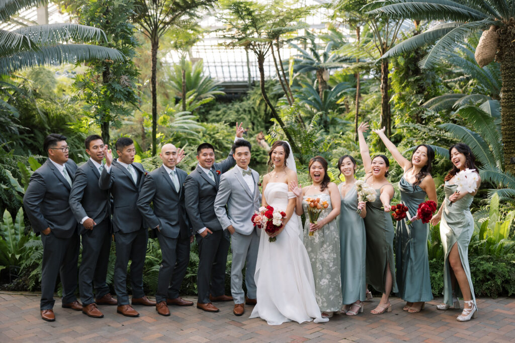 A stunning fall wedding at Garfield Park Conservatory in Chicago. The vibrant autumn foliage serves as a breathtaking backdrop for a couple’s ceremony in the Horticulture Hall, with floor-to-ceiling windows letting in the perfect natural light. Captured by Violet Carter Photography.