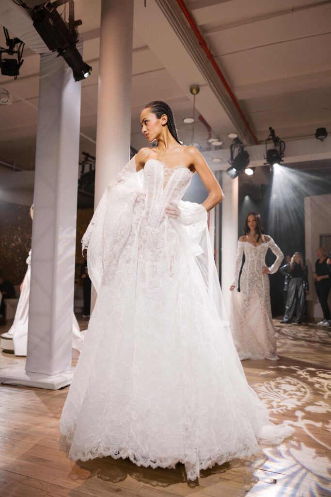 Bride in Galia Lahav ballgown with exaggerated train at New York Bridal Fashion Week 2025