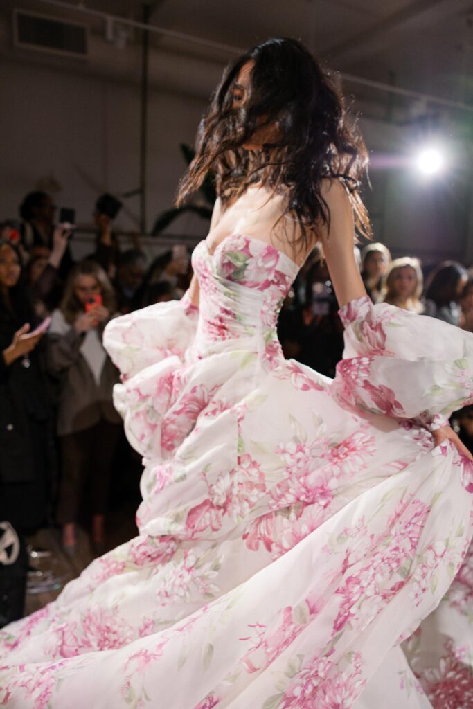 Bride in Galia Lahav colorful ballgown with exaggerated train at New York Bridal Fashion Week 2025