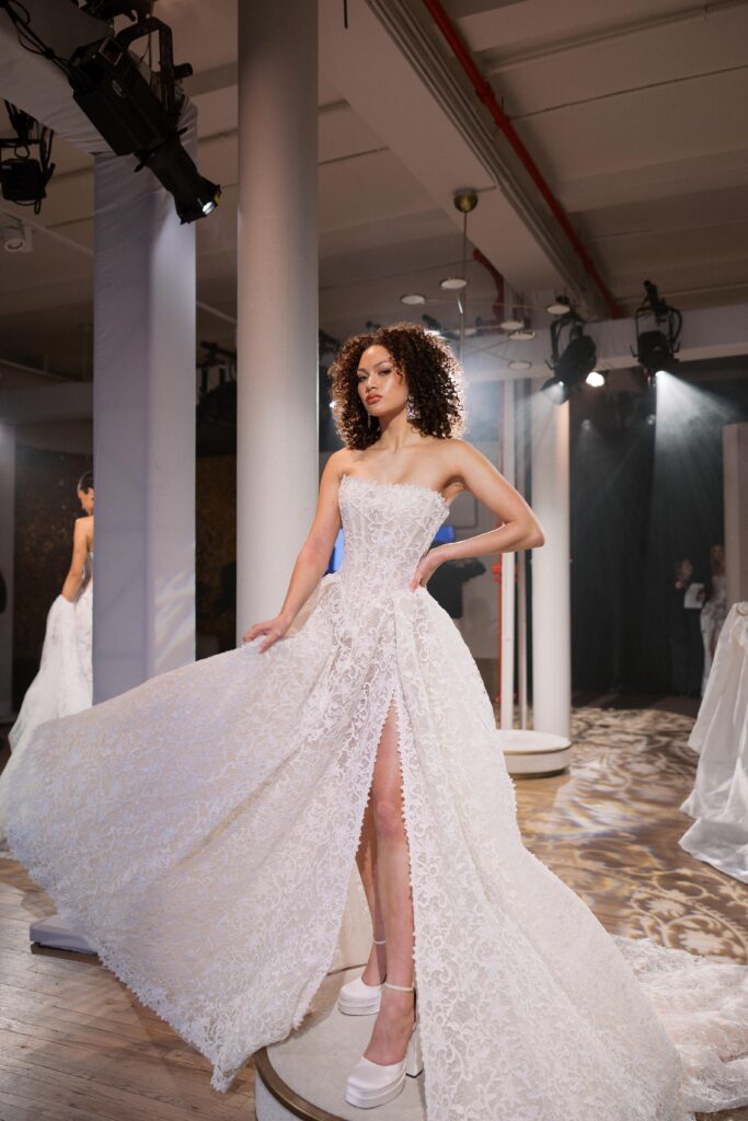 Bride in Galia Lahav ballgown with exaggerated train at New York Bridal Fashion Week 2025